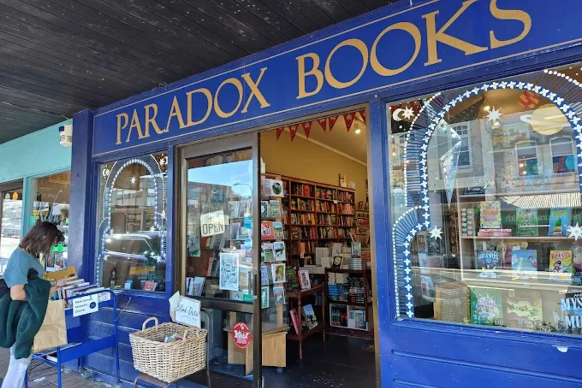 Staff assisting a customer at Paradox Books in Devonport