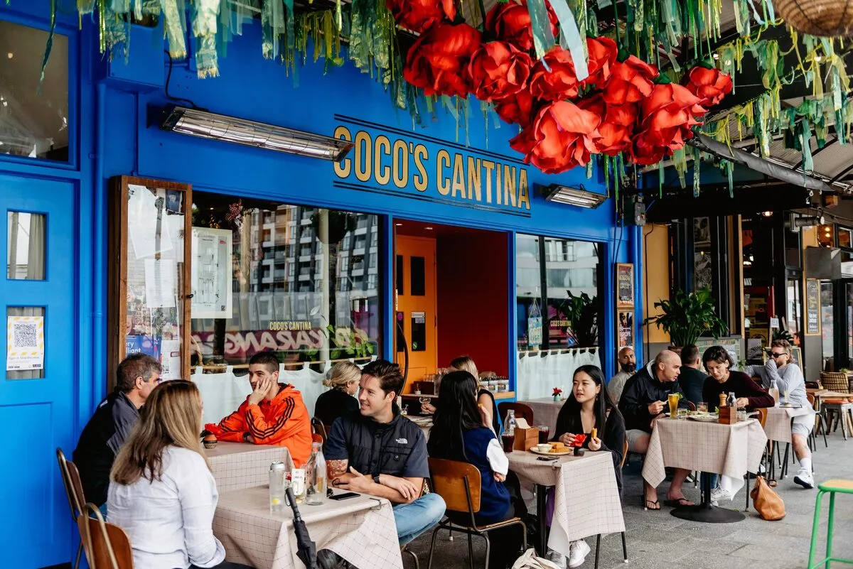 Diners enjoying a meal outside Coco’s Cantina