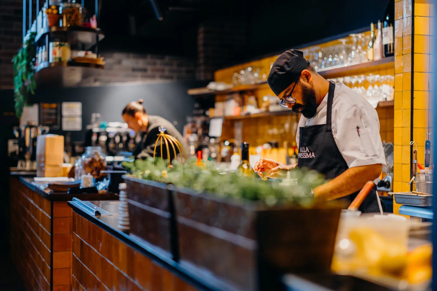 A chef at work behind the bar at Alla Prossima