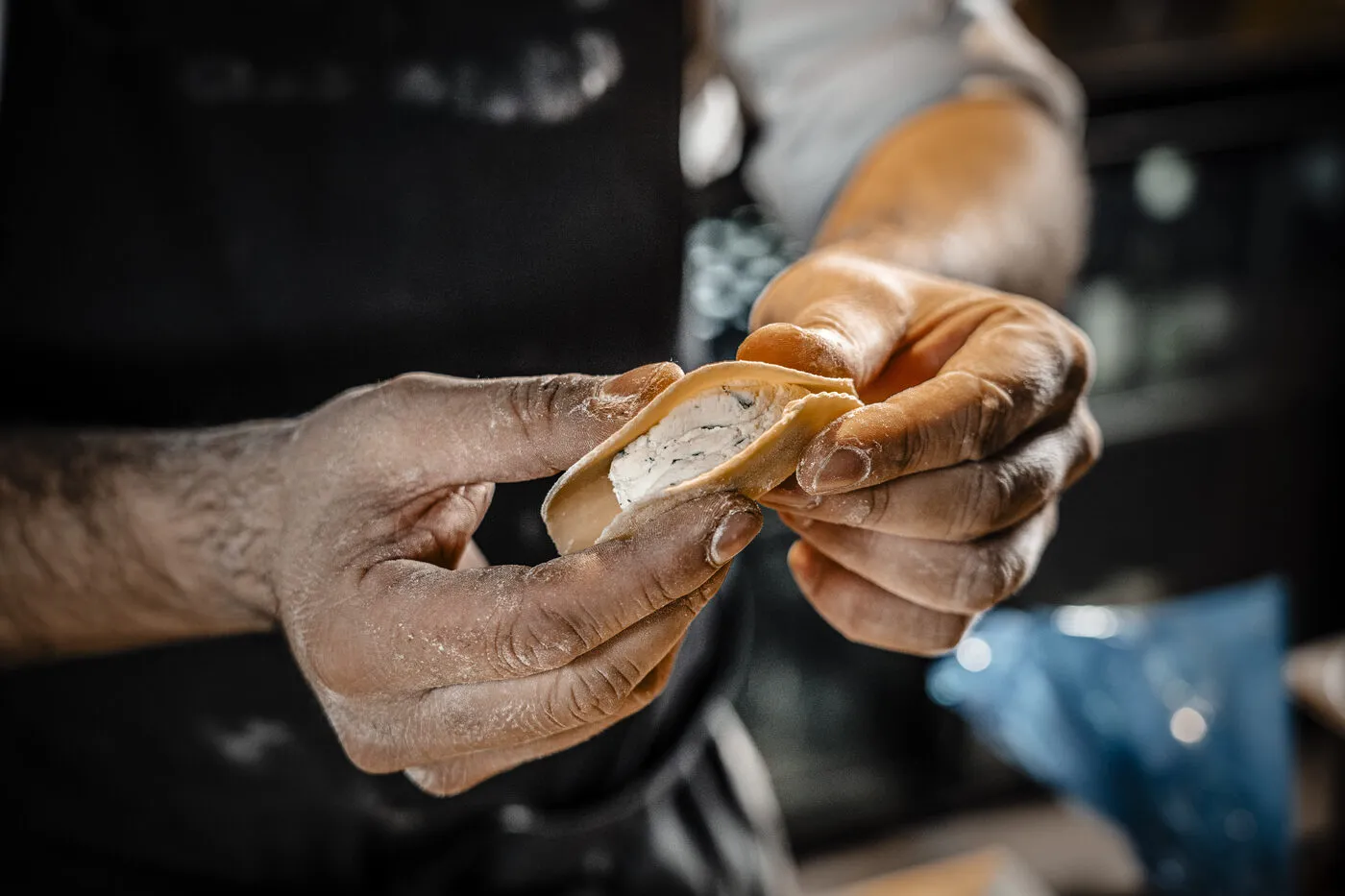 A chef hand-shaping fresh pasta at Alla Prossima